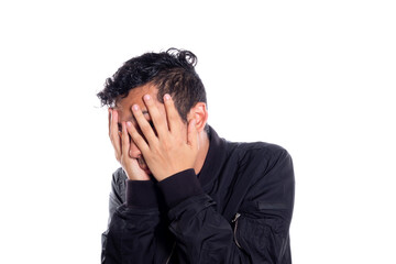 Embarrassed man covering his face with his hands. White background. Man covering his face and...