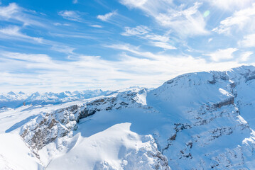Landscape of snow-capped mountains in the Diablerets glacier 3000 meters above sea level in Switzerland with a blue sky