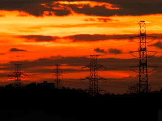 Tokyo,Japan - October 21, 2021: High voltage electricity transmission line tower on morning sky
