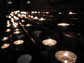 numerous Tea light candles at a cathedral (krakow Poland)
