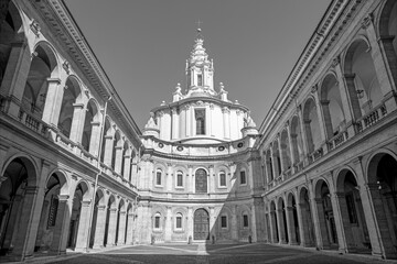 Fototapeta na wymiar Rome - The facade and atriuum of baroque church Chiesa di Sant'Ivo alla Sapienza designed by Francesco Borromini (1642 -1660).
