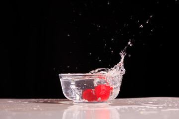 The cherries splashed into the water
