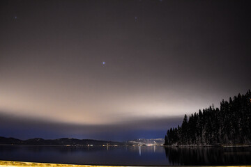 Landscape of Lake Tahoe with long exposure under a cloudy sky at night in the US