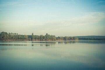 Fototapeta premium The sunset (dawn) is beautiful on the river, pond, lake beyond Moscow.