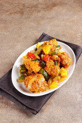 Ayam Koloke or Kuluyuk Chicken, is a Chinese Indonesian dish made from crispy chicken seasoned with red sweet and sour pineapple sauce. Popular as Ayam Asam Manis