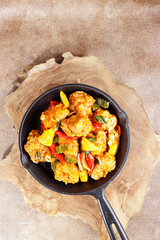 Ayam Koloke or Kuluyuk Chicken, is a Chinese Indonesian dish made from crispy chicken seasoned with red sweet and sour pineapple sauce. Popular as Ayam Asam Manis