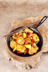 Ayam Koloke or Kuluyuk Chicken, is a Chinese Indonesian dish made from crispy chicken seasoned with red sweet and sour pineapple sauce. Popular as Ayam Asam Manis