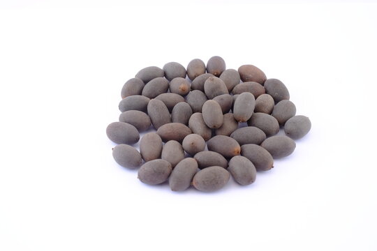 Nelumbo nucifera Gaertner seeds ,  Pile of dried lotus seeds isolated on white background