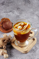 Wedang Bandrek kelapa muda is a traditional drink from West Java, Indonesia, made from ginger, brown sugar, spices and young coconuts. 