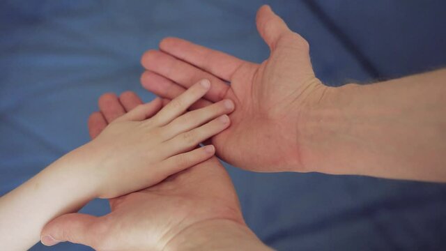 child hand to an adult