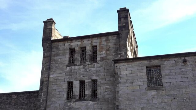 Medieval style building with barred windows and battlements at Eastern State Penitentiary.