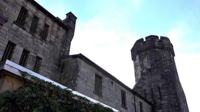 Medieval style building with tower and parapet.