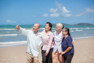 Asian happy family enjoy relaxing on the beach. Happy family taking selfie on sea beach