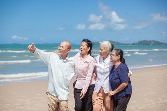 Asian happy family enjoy relaxing on the beach. Happy family taking selfie on sea beach