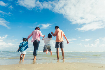 Happy young family Asian have fun on beach. Young family on vacation have a lot of fun