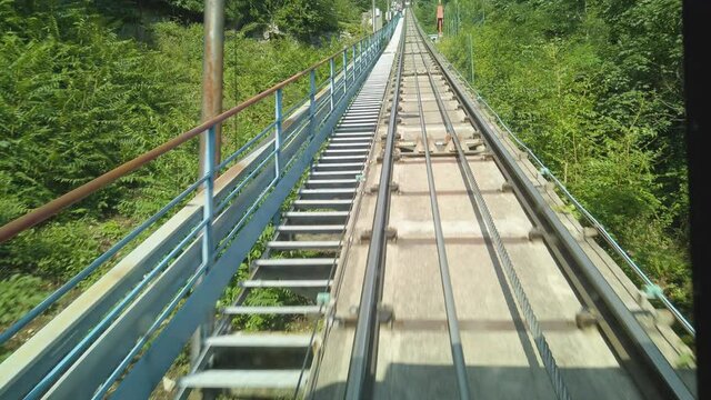 Video from inside the Brunate cable car as it ascends from Como up to Brunate, by Lake Como, Lombardy, Italy. The camera is facing the tracks at the back of the car. 