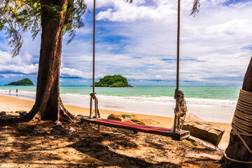 Fototapeta premium ea view,overlooking trees and swings,people playing in the sea ,have island in the sea