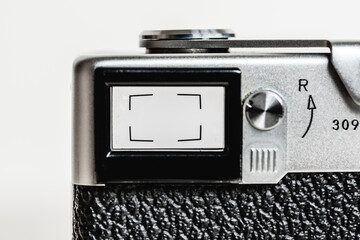 Close-up vintage viewfinder of film camera on white background ,old rangefinder camera