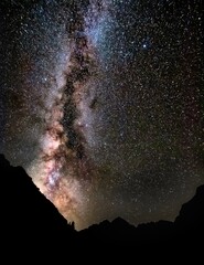 Fototapeta na wymiar Milky way galaxy rising over Maroon Bells in Colorado