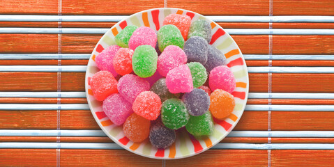 Bowl with colored gummy candies.