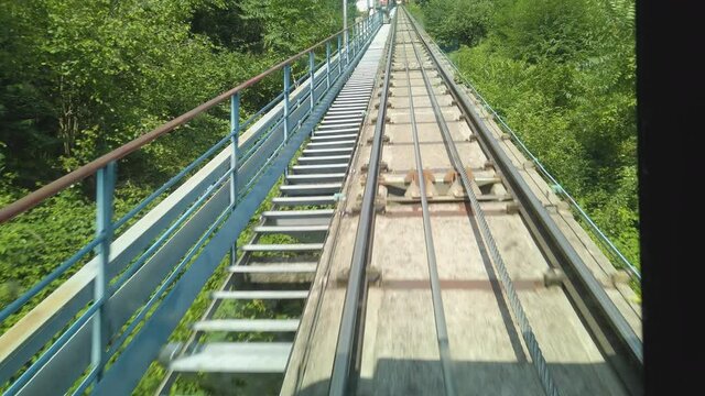 Video from inside the Brunate cable car as it descends from Brunate down to Como, by Lake Como, Lombardy, Italy. The camera is facing the tracks at the back of the car. 
