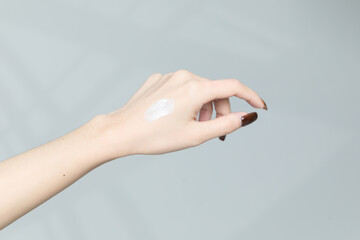 Moisturizing care skincare face cream for healing complicated troubled skin type in an open jar with visible texture. Copy space, close up, background, flat lay, top view. Eucalyptus leaf decoration.