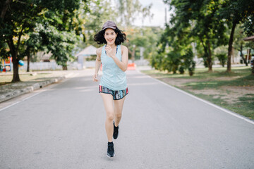 A beautiful woman runner is taking a strong stride for exercise. health care concept