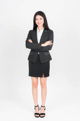 Full length portrait of a business woman , beautiful Asian girl whit suit standing arms crossed isolated on white background , business people concept