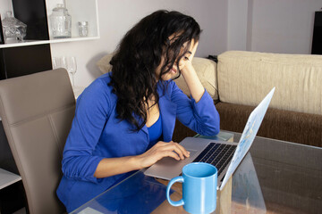 A depressed executive reading the reports of her work group, dressed in blue and with a blue coffee...