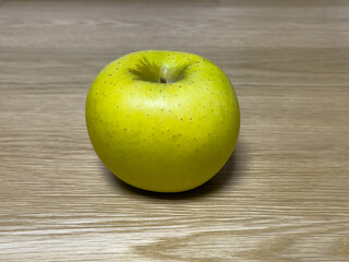 yellow green apples on oak table