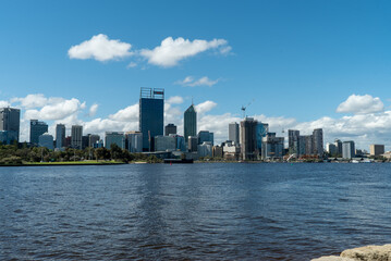 Fototapeta na wymiar A view of the Perth city metropolitan skyscrapers from the other side of the swan river