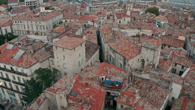 Descending drone shot of Montpellier tilled roof houses