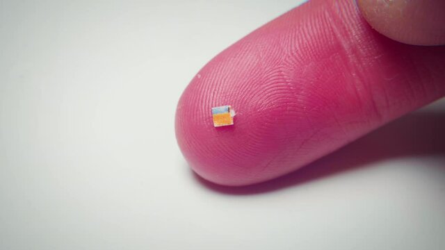 4K macro footage of a micro dose of LSD on a finger.