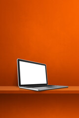 Laptop computer on orange shelf. Vertical background