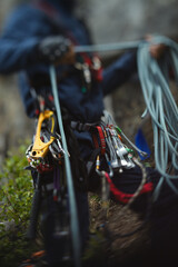 Obraz premium Climbing equipment on the belt climber, abstract blurred image, close-up.