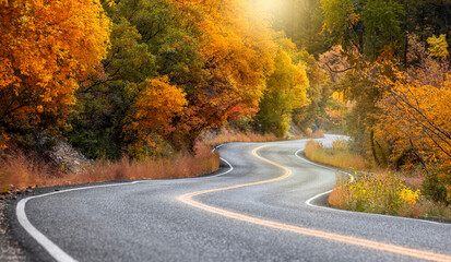 Scenic winding byway Alpine loop in Utah surrounded with brilliant fall foliage