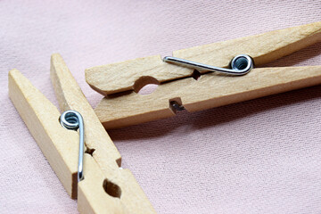 wood clothes peg on a fabric background