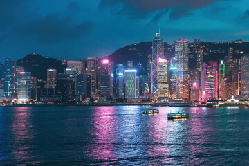 Colorful night view of the famous tourist location, Victoria Harbour, Hong Kong