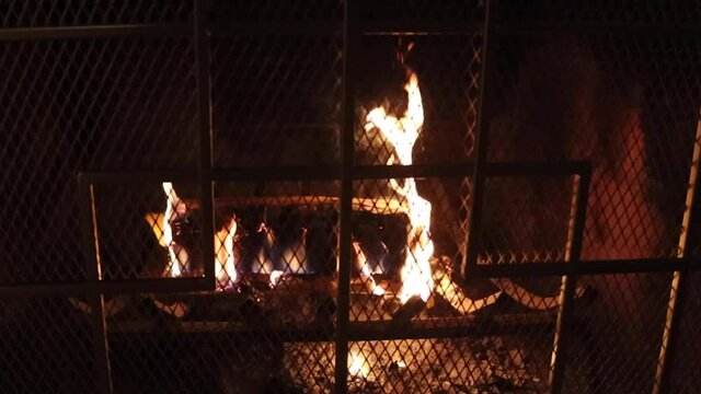 Warm and cozy fireplace with vibrant flames captured in slow motion