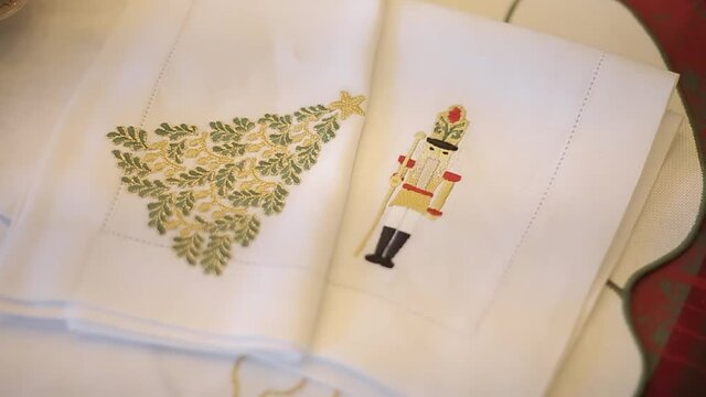 beautiful white cloth napkins with christmas decoration on christmas table for sharing. christmas celebration time concept.