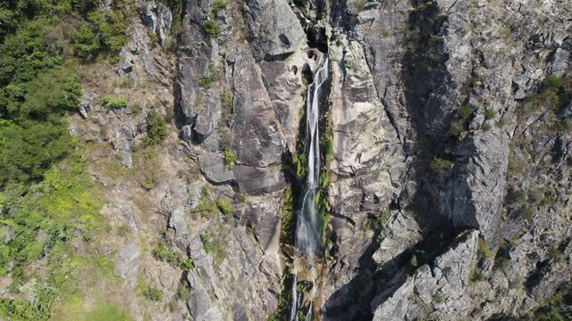 Rock wall with stream fresh mountain waterfall, Cascata da Frecha da Mizarela, Arouca, Portugal
