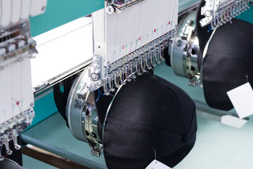 Embroidery machines, textile industry. Hat factory.