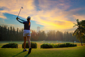Golfer Woman playing golf People swing and hitting golf course is on the fairway. Hobby in holiday and vacations on club golf. Lifestyle and Sport Concept