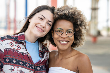 selfie of two lesbian women, happy smiling, outdoors