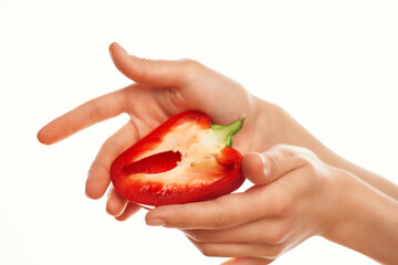 red pepper in hand, cut in half ingredients for salad