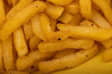 French fries on a plate, close-up, selective focus.