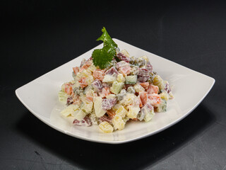 Traditional Russan salad Olivier with sausages