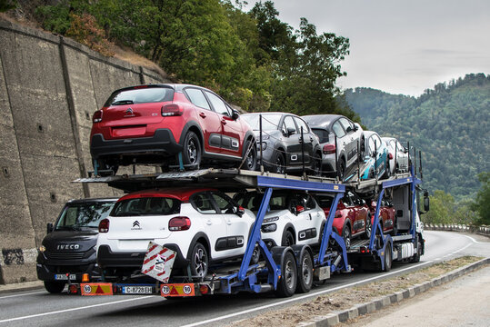 Truck carrying cars. Automotive and transport industry - concept. The cars are Citroen C 3, produced by the French company Citroën. Romania, Severin. September, 17, 2021