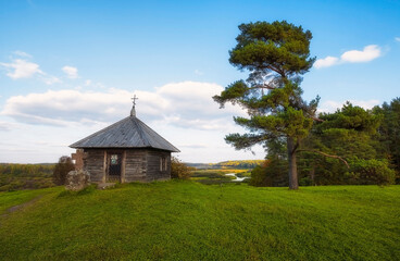 Rural landscape with views of the small chapel,  forest and fields. Pushkin Hills with Savkina...