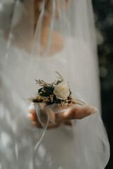 bride holding wedding flowers bouquet at her hand in her wedding day
